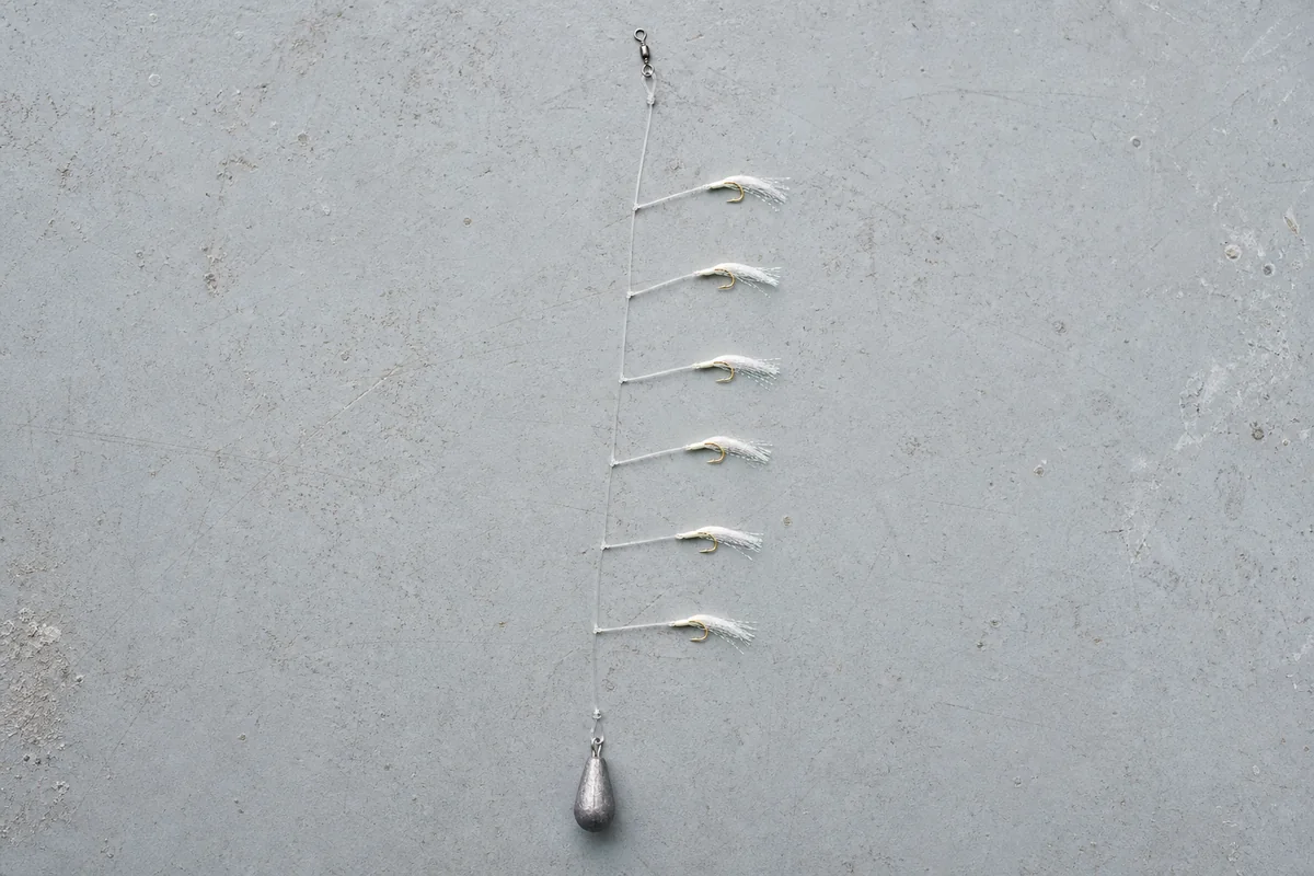 Complete six-hook Sabiki rig with dressed hooks, top swivel, and bottom sinker