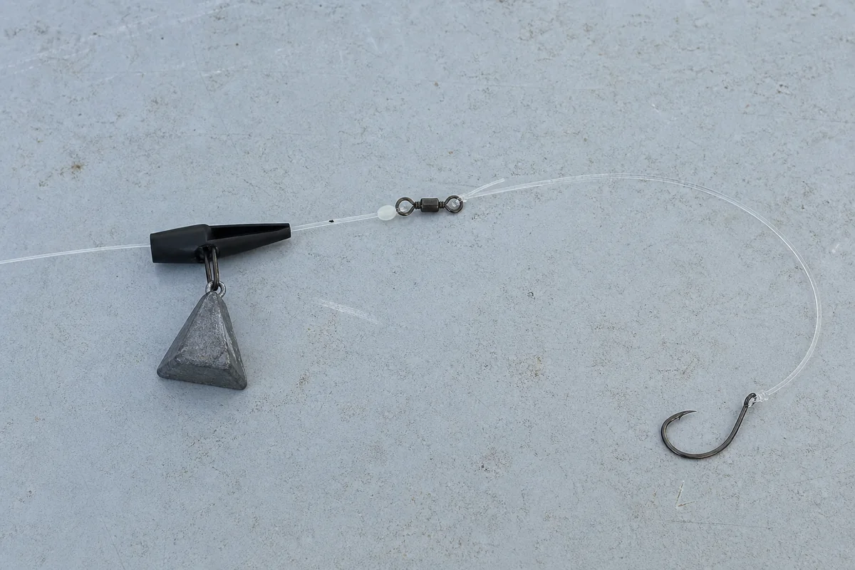 Fish-finder rig with sinker slide, pyramid sinker, bead, swivel, leader, and circle hook